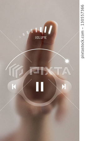 Modern collage. Hand adjusting futuristic digital volume control interface with glowing symbols 130557366