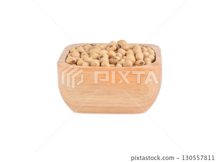 Soy beans seed in wooden bowl isolated on white background. Soy beans seed in wooden bowl isolated on white background. 130557811