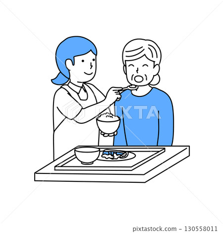 A caregiver assisting elderly people with meals 130558011