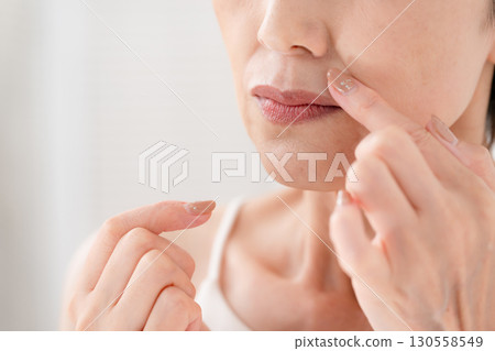 Woman, nasolabial folds, mouth area, worries 130558549