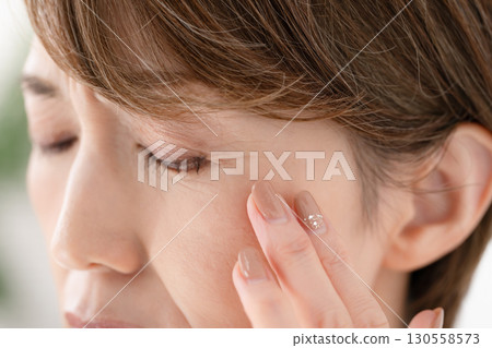 Woman eye worries Woman eye worries 130558573