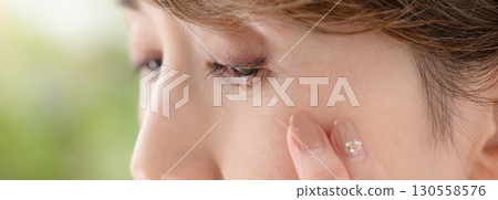 Woman eye worries 130558576