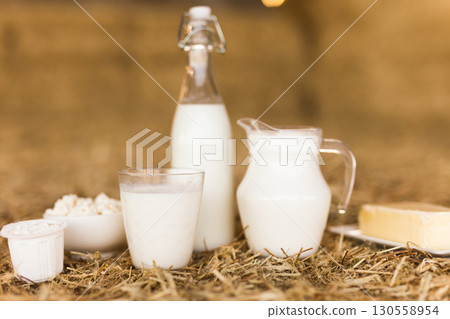 dairy products on table against the background of hay 130558954