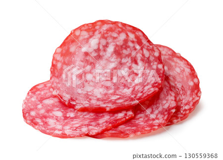 Pile of sliced sausage close-up on a white background. Isolated 130559368