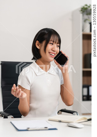 women talk mobile phones appointment reminders in calendar on interface. working on laptop computers, online business. women talk mobile phones appointment reminders in calendar on interface. working on laptop computers, online business. 130559928