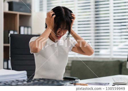 stressed woman working in the office. Businesswoman thinking too much work concept in the office. 130559949