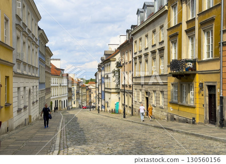 Warsaw Poland May 20 2025 Charming cobblestone street in Old Town with historic buildings, colorful Warsaw Poland May 20 2025 Charming cobblestone street in Old Town with historic buildings, colorful 130560156