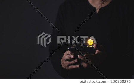 Happy Customer, Young Man hand touching emoji and five star to review and give 5 stars Happy Customer, Young Man hand touching emoji and five star to review and give 5 stars 130560275