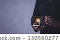 Young man with smartphone mobile hand touching to visualize money growth  130560277