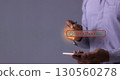 Young man with smartphone hand using a pen touching Shut Down button press power OFF 130560278