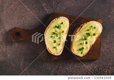 Close up of sandwiches with zucchini and onion spread on ciabatta on a board  top view 130561039