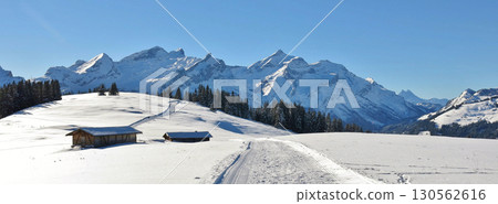 Winter hiking and sledging trail, Wispile. Mountain landscape near Gstaad, Switzerland. Winter hiking and sledging trail, Wispile. Mountain landscape near Gstaad, Switzerland. 130562616