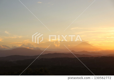 Mount Fuji shining golden in the setting sun and Mount Myojin, one of the Hakone outer rim mountains Mount Fuji shining golden in the setting sun and Mount Myojin, one of the Hakone outer rim mountains 130562772