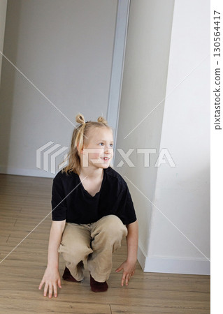 Happy smiling child girl playing at home Happy smiling child girl playing at home 130564417