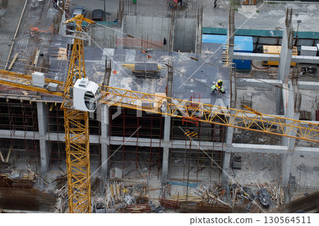 Tower Crane Working on Construction Building Tower Crane Working on Construction Building 130564511