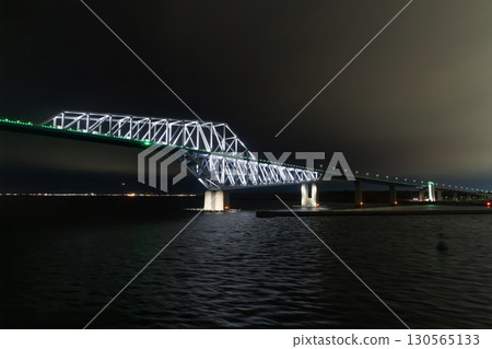 View of Tokyo Gate Bridge before passing from a car ferry departing from Tokyo Ariake in Koto Ward, Tokyo at night 130565133