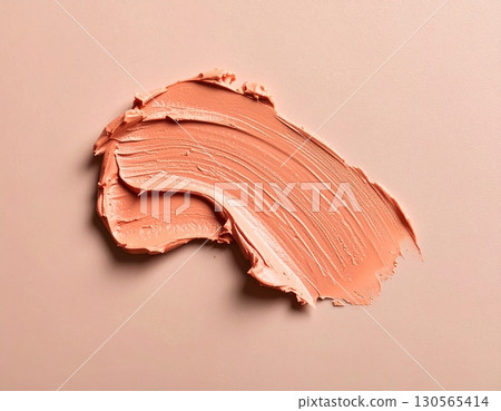 Smudged pink orange lipstick set on background 130565414