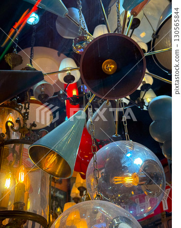 Transparent spherical lamps with glowing filaments. Futuristic design and modern lighting. 130565844