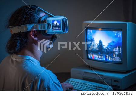 The man is focused on the screen, and the game appears to be quite intense 130565932