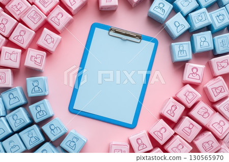 Flat Lay Composition of Clipboard Surrounded by Customer Icons in Pink and Blue Colors Flat Lay Composition of Clipboard Surrounded by Customer Icons in Pink and Blue Colors 130565970