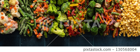 Eye-catching banner with frozen fruits and vegetables, emphasizing the vibrant, seasonal process of freezing healthy produce for winter, ideal for health-related advertisements 130568004