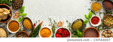 Colorful, fresh herbs and spices framing a gray background, a perfect natural border to bring attention to culinary creativity, top view and copy space, banner Colorful, fresh herbs and spices framing a gray background, a perfect natural border to bring attention to culinary creativity, top view and copy space, banner 130568007