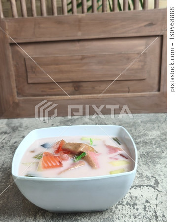 A refreshing bowl of Es Campur, a traditional Indonesian ice mixed fruit dessert. 130568888