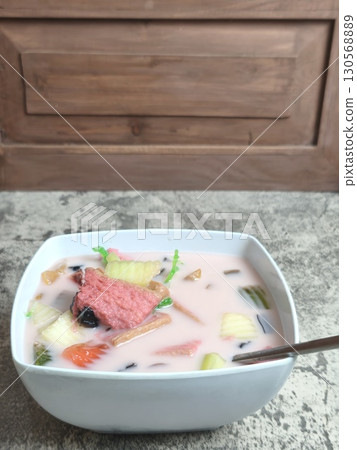 A refreshing bowl of Es Campur, a traditional Indonesian ice mixed fruit dessert. A refreshing bowl of Es Campur, a traditional Indonesian ice mixed fruit dessert. 130568889