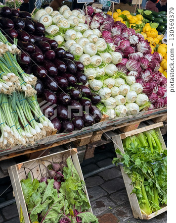 Vegetables well organized and presented on the food market. Torvehallerne food market in Copenhagen, Denmark. Healthy eating with fresh plant-based diet from local farm market. Vegetables well organized and presented on the food market. Torvehallerne food market in Copenhagen, Denmark. Healthy eating with fresh plant-based diet from local farm market. 130569379