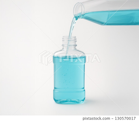 A clean image of pouring mouthwash into a container 130570017