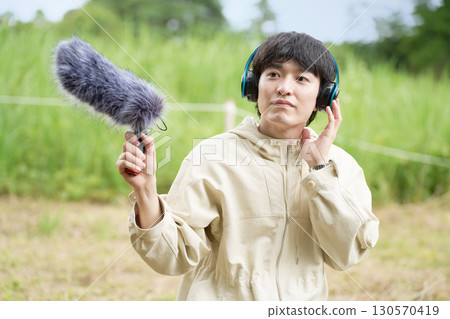 Sound engineer checking the sound with headphones on 130570419