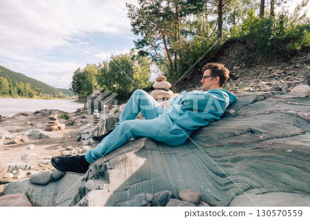 Man at the river Katun at summer day 130570559