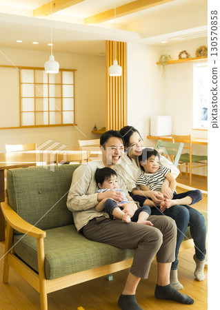 Family to relax on sofa Family to relax on sofa 130570858