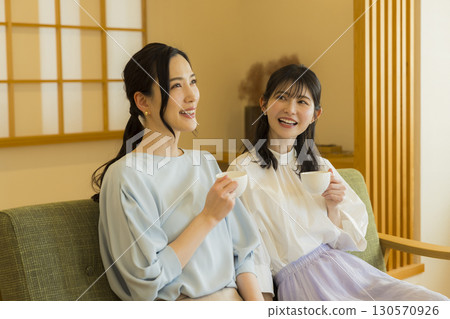 Two women drinking tea Two women drinking tea 130570926