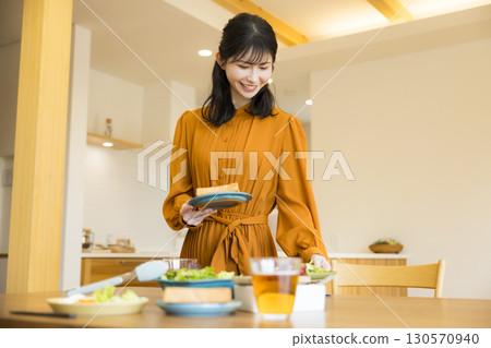 A woman serving a meal 130570940