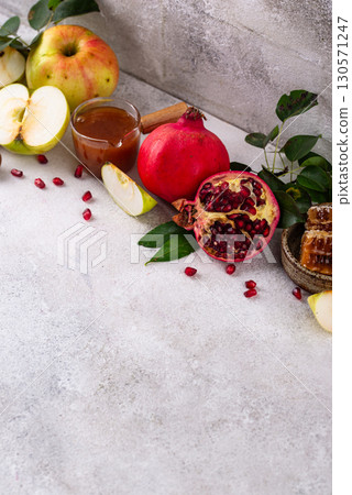 Rosh Hashana concept with honey, apple and pomegranate 130571247