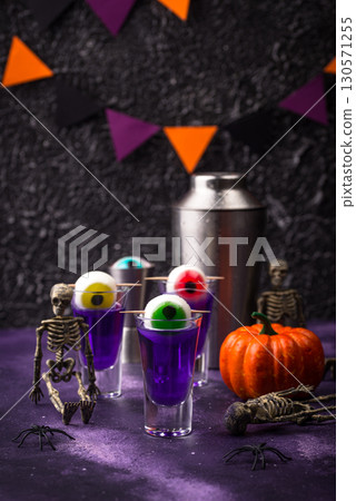 Halloween purple cocktail with eyes. Halloween purple cocktail with eyes. 130571255