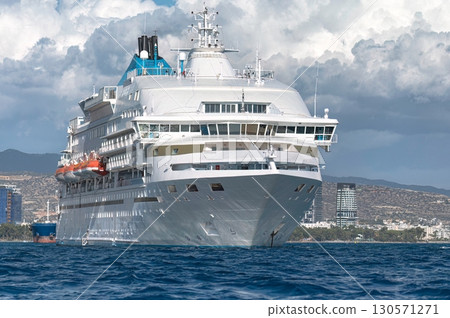 Cruise ship sailing near limassol coast on a cloudy day Cruise ship sailing near limassol coast on a cloudy day 130571271
