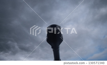 A cannon stands ready to unleash destruction against a backdrop of dark, swirling clouds, symbolizing the turmoil of war in Russia. The tension is palpable in the air. 130571340