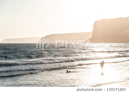 Family enjoying sunset at Kourion beach in Cyprus Family enjoying sunset at Kourion beach in Cyprus 130571805