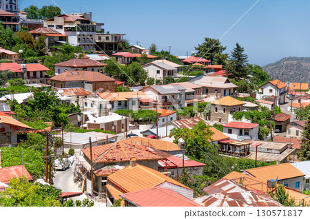 Pedoulas village in Cyprus showing colorful houses covering the mountainside on a sunny day 130571817