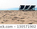 Relax time on the beach. beach chaise set up for travelers on the beach in Thailand on sunny days. Summer vacation and holiday. 130571902