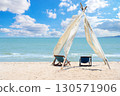 Relax time on the beach. beach chaise set up for travelers on the beach in Thailand with blue sky on sunny days. Summer vacation and holiday. 130571906