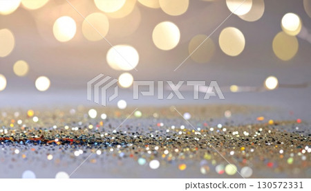 Golden Glitter on Reflective Surface with Bokeh Light Effect Background 130572331