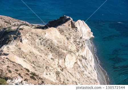 Limestone white cliffs of Cape Aspro plunging into deep blue Mediterranean waters near Pissouri, Cyprus, revealing dramatic coastal scenery Limestone white cliffs of Cape Aspro plunging into deep blue Mediterranean waters near Pissouri, Cyprus, revealing dramatic coastal scenery 130572544