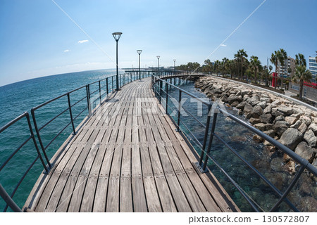 Wooden footbridge stretching out over blue sea in Limassol, Cyprus Wooden footbridge stretching out over blue sea in Limassol, Cyprus 130572807
