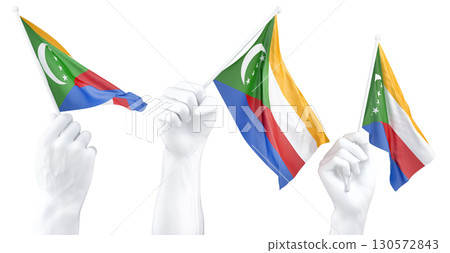Hand holding flag of Comoros. Isolated 3d Rendering Hand holding flag of Comoros. Isolated 3d Rendering 130572843