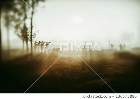 Soldiers engage in a foggy battle scene at dawn near a wartime landscape Soldiers engage in a foggy battle scene at dawn near a wartime landscape 130573886