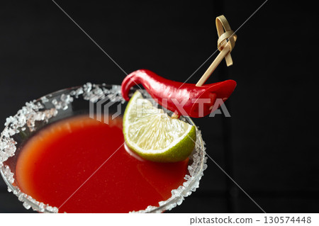 Bloody Mary cocktail with lime and red pepper. Bloody Mary cocktail with lime and red pepper. 130574448