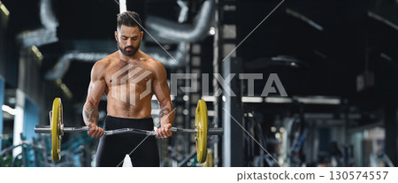 Concentrated powerlifter training with heavy barbell at gym, free space, web-banner Concentrated powerlifter training with heavy barbell at gym, free space, web-banner 130574557